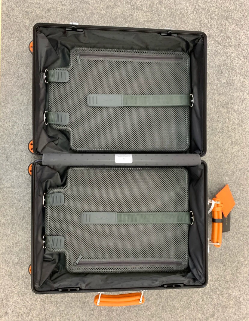 Matte Black Hardshell Spinner Suitcase with Orange Handles and Wheels