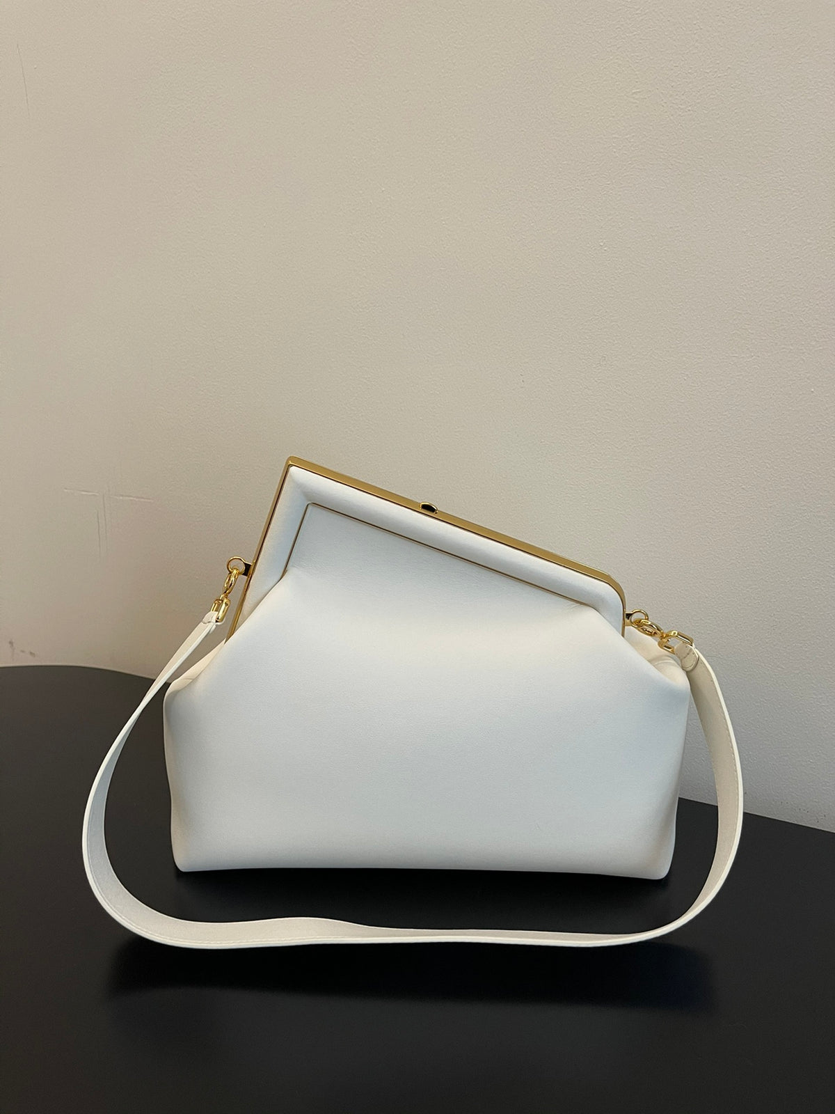 Elegant White Leather Clutch Bag with Unique F-Shaped Frame and Detachable Shoulder Strap