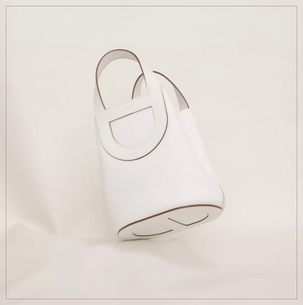 Elegant White Leather Mini Bucket Bag with Circular Cutout Handles
